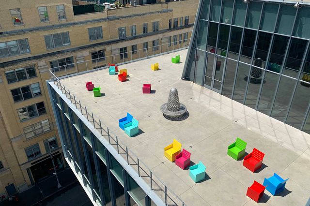 colorful chairs on an outdoor section of the Whitney museum